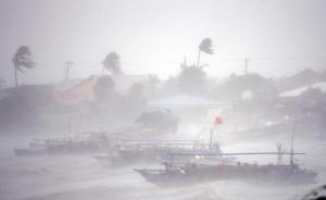 Fishing boats are pictured amid heavy winds and rain brought by Typhoon Rammasun as it hit the town of Imus