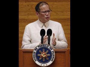 President Benigno Aquino gestures as he delivers his State of the Nation Address during the 15th Congress at the House of Representatives Monday. AP